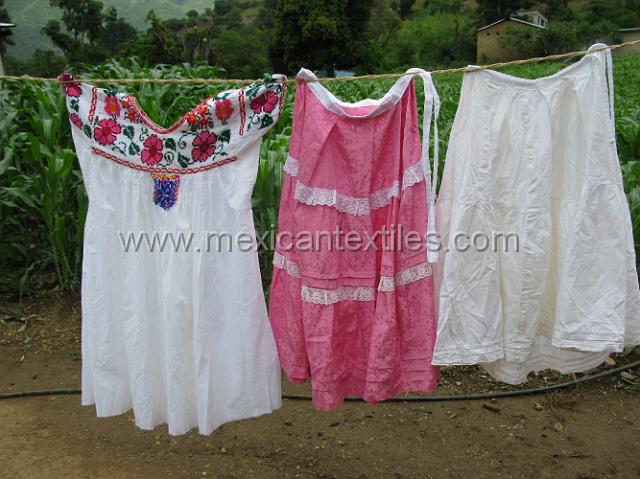 trapiche_viejo__32.JPG - The family had been trying for years to have the mother toss out her traditional dresses and blouses , but she has steadfastly refused. here is a blouse, dress and slip.